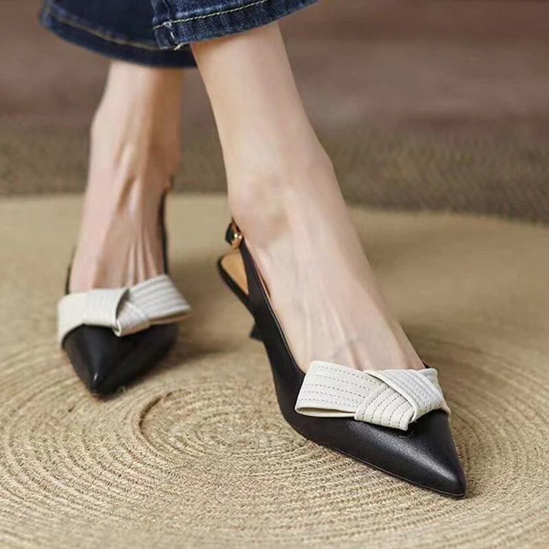Slingback pumps met spitze neus
