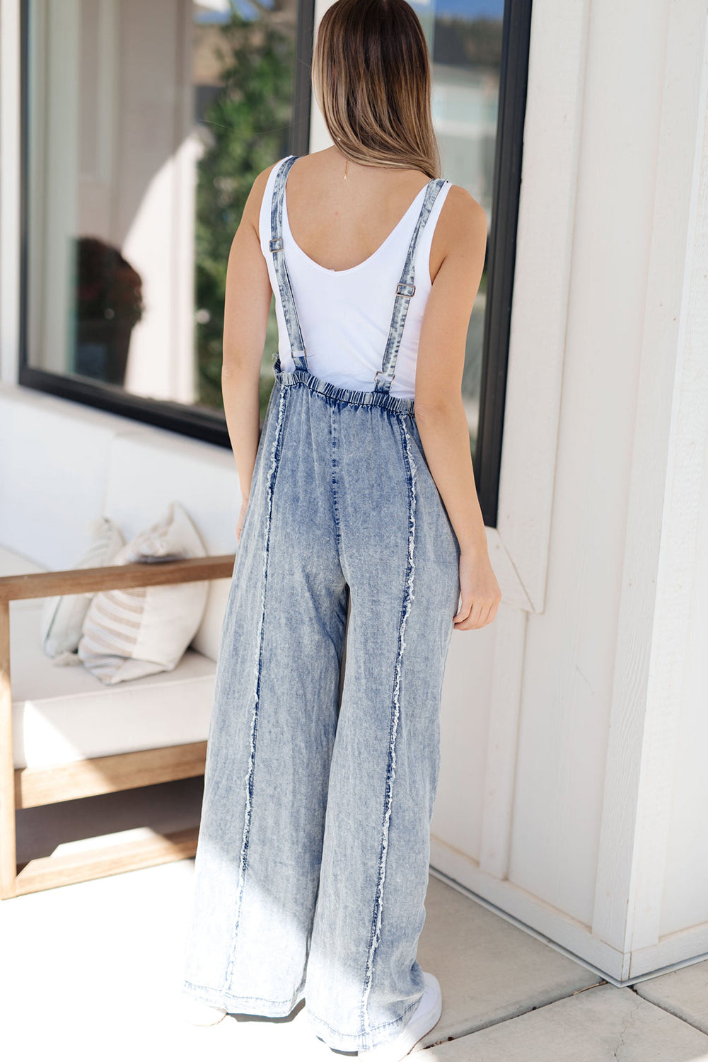 Blauwe denim overall met wijde pijpen