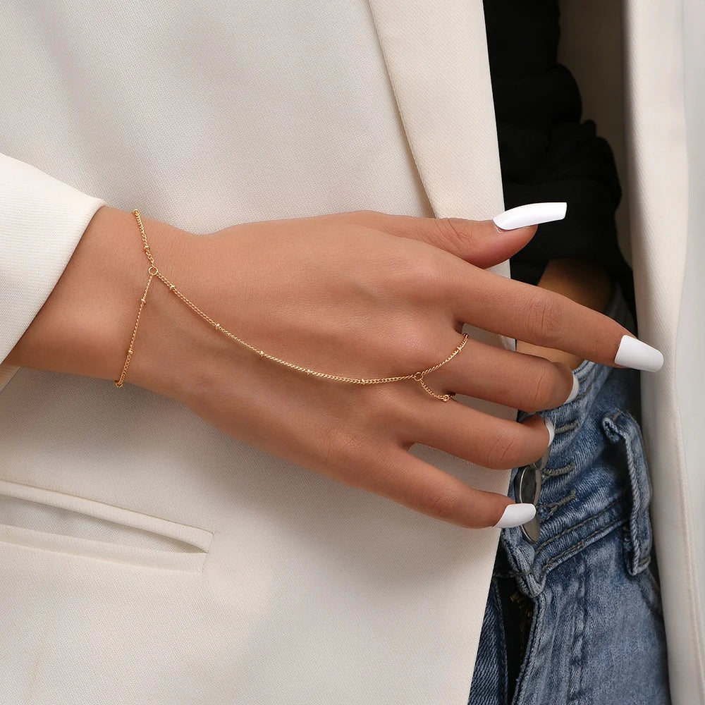 Annemarie | Gouden dames hand chain armband – verfijnd ontwerp met handring voor een luxe uitstraling