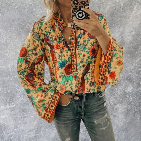Oranje damesblouse | Bloemenprint met uitlopende mouwen en opstaande kraag